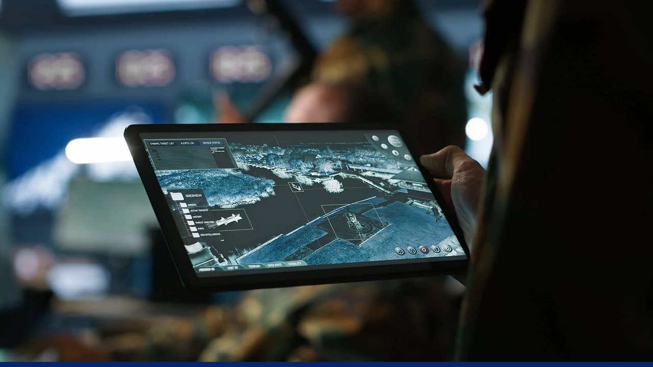 Soldier views tactical map on rugged tablet